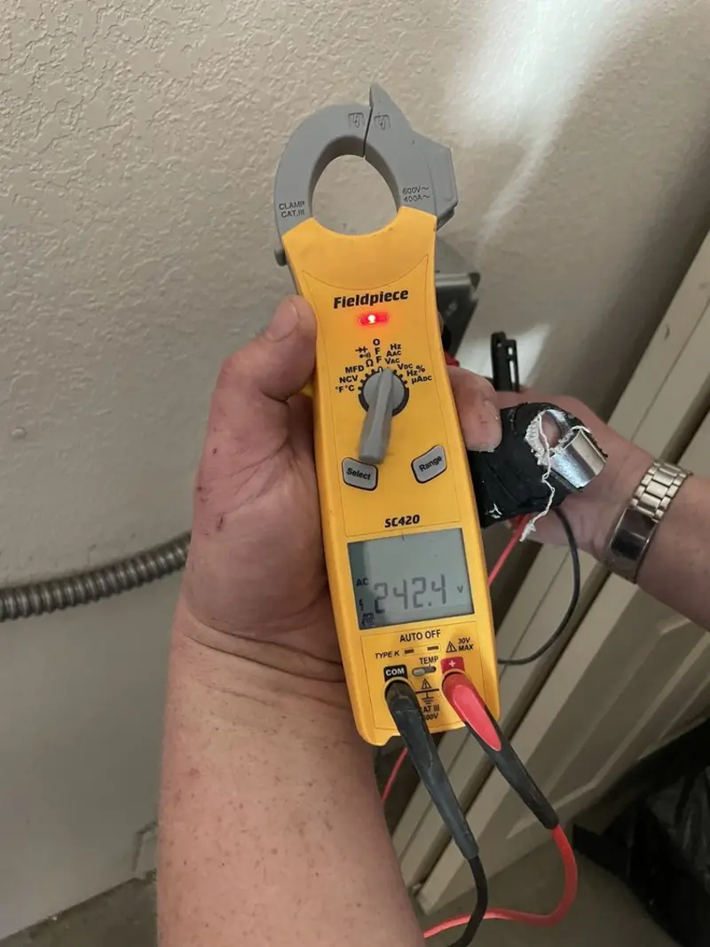 Voltage testing with clamp meter during Aluminum Wiring Replacement in Conroe